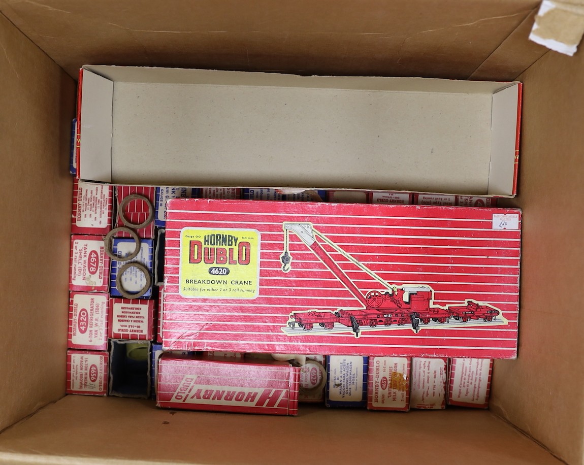 A large quantity of Hornby Dublo carriages, wagons and other rolling stock, much with original boxes, much unboxed, spare boxes which may well match, 5 boxes